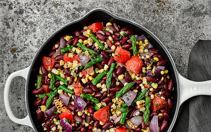 Grilled veggies and Bush's Best® Low Sodium Kidney Beans create a Succotash recipe with Charred Lemon-Chive Vinaigrette features for K-12 or C&U foodservice.